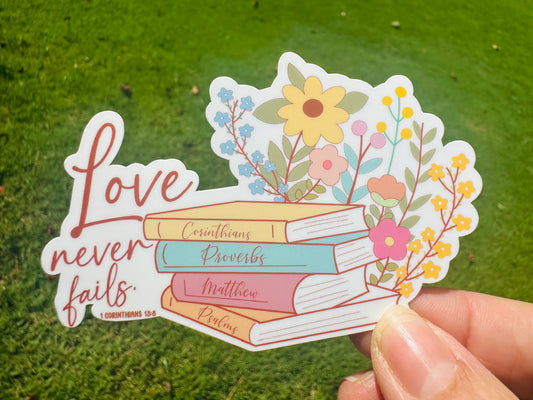 Sticker: “Love never fails”